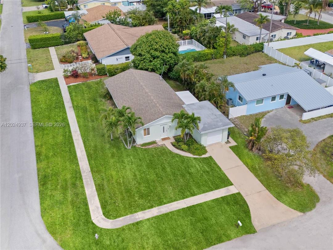 Nestled in the heart of East Boca Raton, this charming single family home presents an exceptional opportunity for buyers, investors, or visionaries looking to create their dream residence.