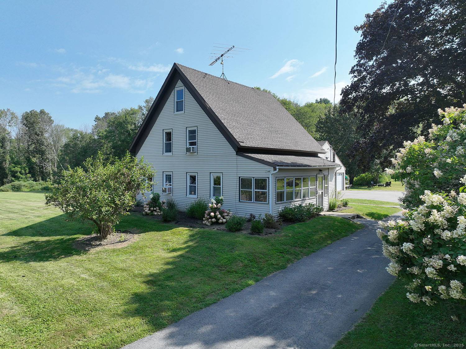 Discover a timeless blend of history and modern comfort at 71 Rawson Road, a lovingly modernized 1800s Colonial style farmhouse located off a serene country road in Woodstock, CT.