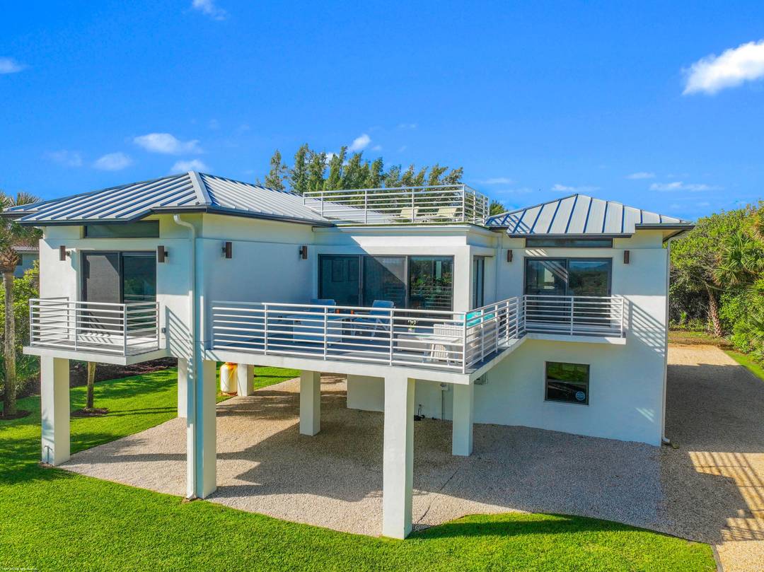 Completely renovated in 2023 this beautiful modern home has commanding ocean views just yards from the surf.