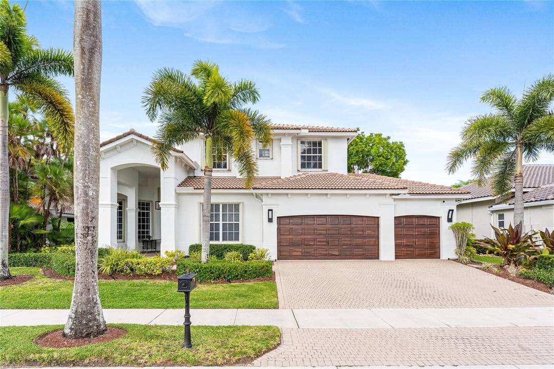 Commanding sweeping golf course views in the prestigious Weston Hills Country Club, this exceptional estate is perfectly positioned on an oversized lot with no rear neighbors, offering rare privacy and ...