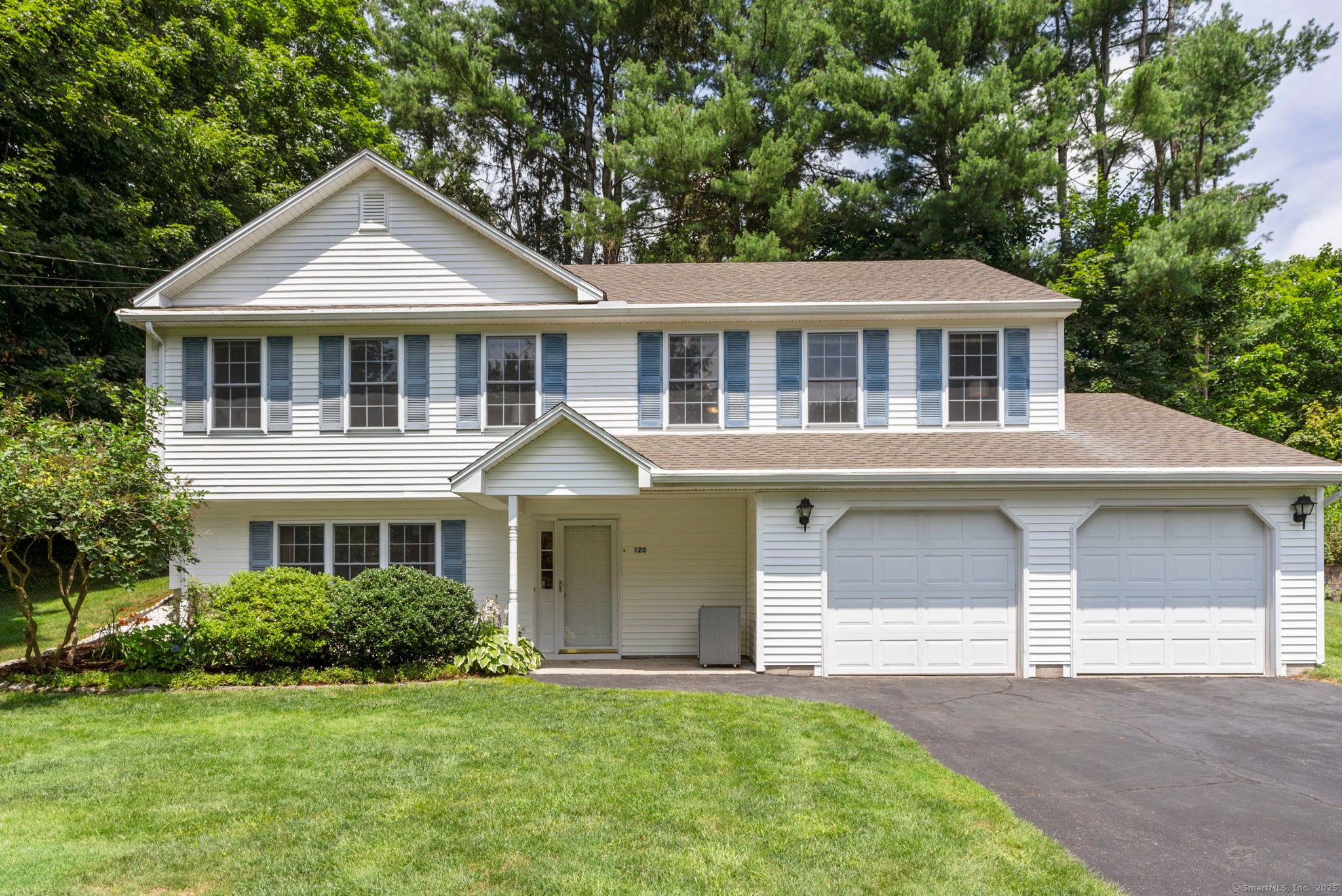 Welcome to this pristine raised ranch in the heart of Simsbury, proudly owned by one family since it was built in 2000.