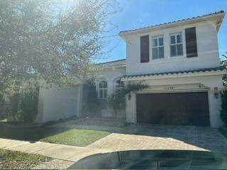 This former model home showcases premium upgrades throughout, including Hurricane Impact Windows for peace of mind.