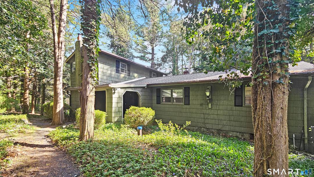 Tucked away at the end of a shared private driveway, this 5BR home sits on 2.