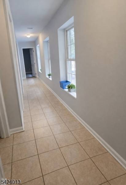 EXCEPTIONAL INCOME PRODUCING OPPORTUNITYVersatile commercial property featuring 3 office spaces and 3 garage warehouse units with overhead doors and loading dock, plus a large usable yard.