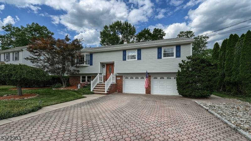 Nestled on a beautiful tree lined street that radiates pride of ownership, this meticulously maintained Bi Level home offers 3 bedrooms with the option for a 4th, 2.