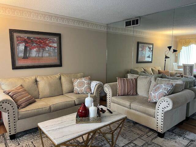 Beautiful 2 bedroom condo with a covered screened porch with new tile.