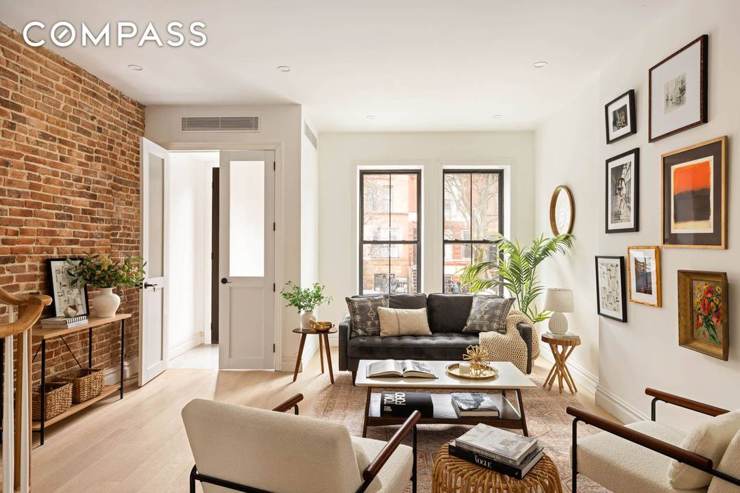 Welcome to this beautifully reimagined 1915 townhouse a fully gut renovated two family residence that seamlessly blends classic architecture with refined modern living.