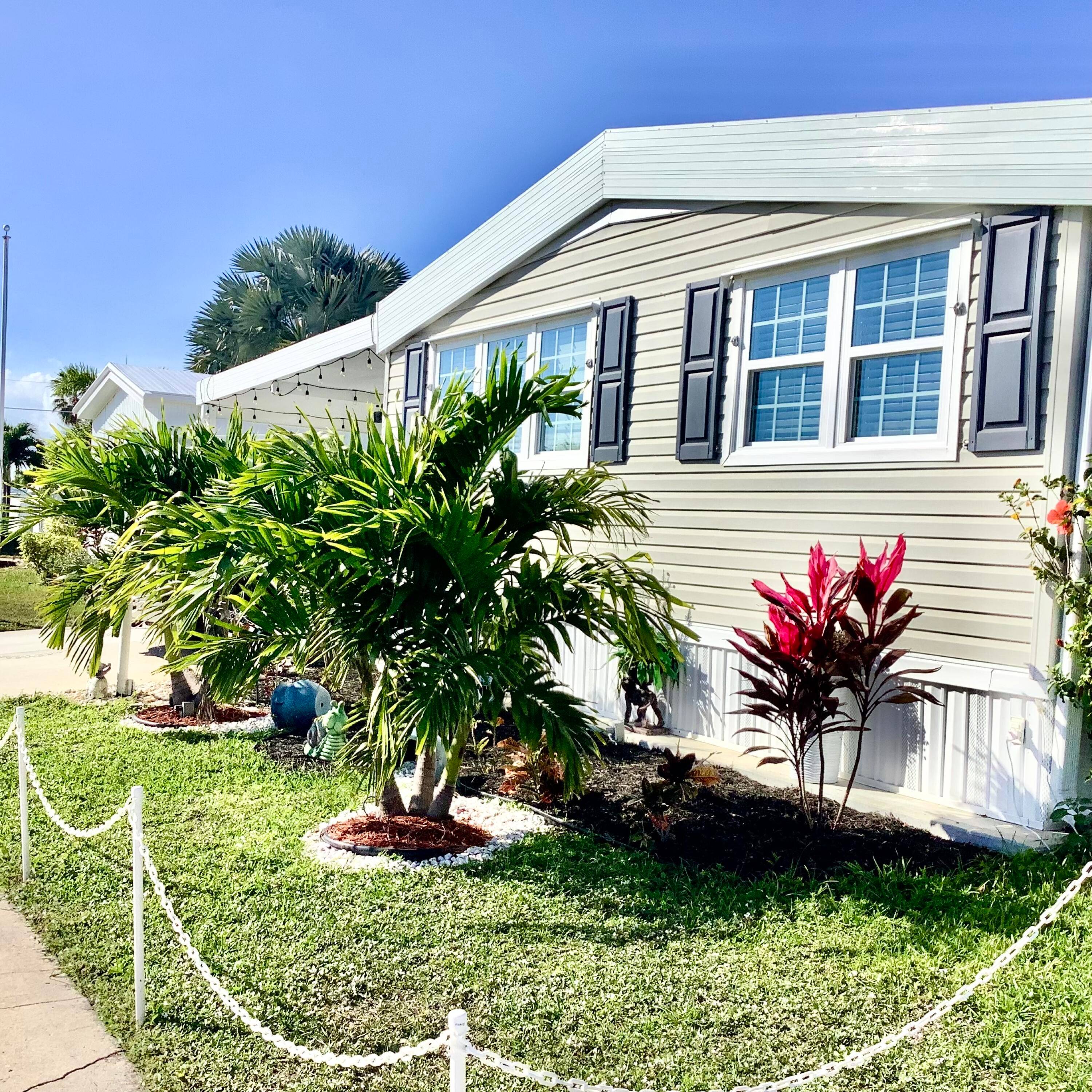 This stunning, fully renovated double wide home in Tropical Breeze Estates is a true gem.