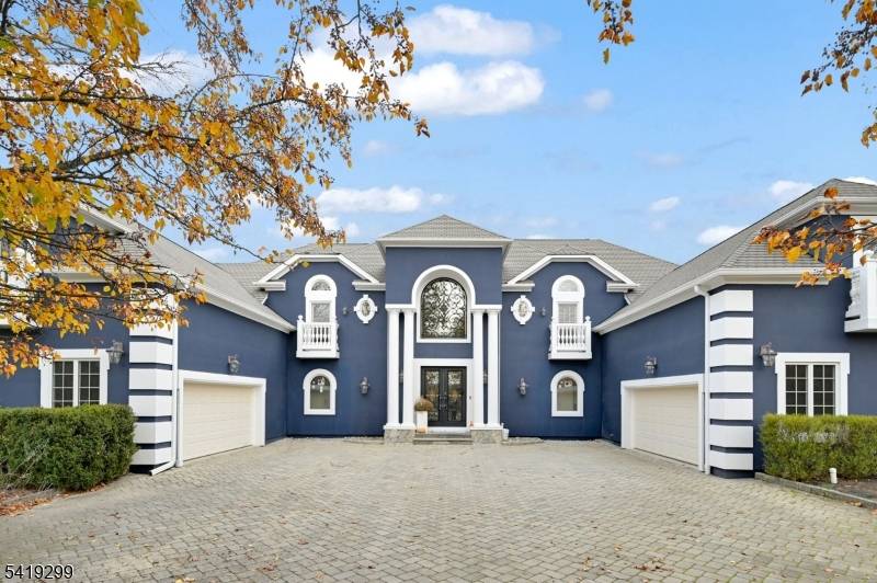 This 5 bedroom, 5 bathroom custom estate sits on over 5 private acres in a quiet, serene setting.