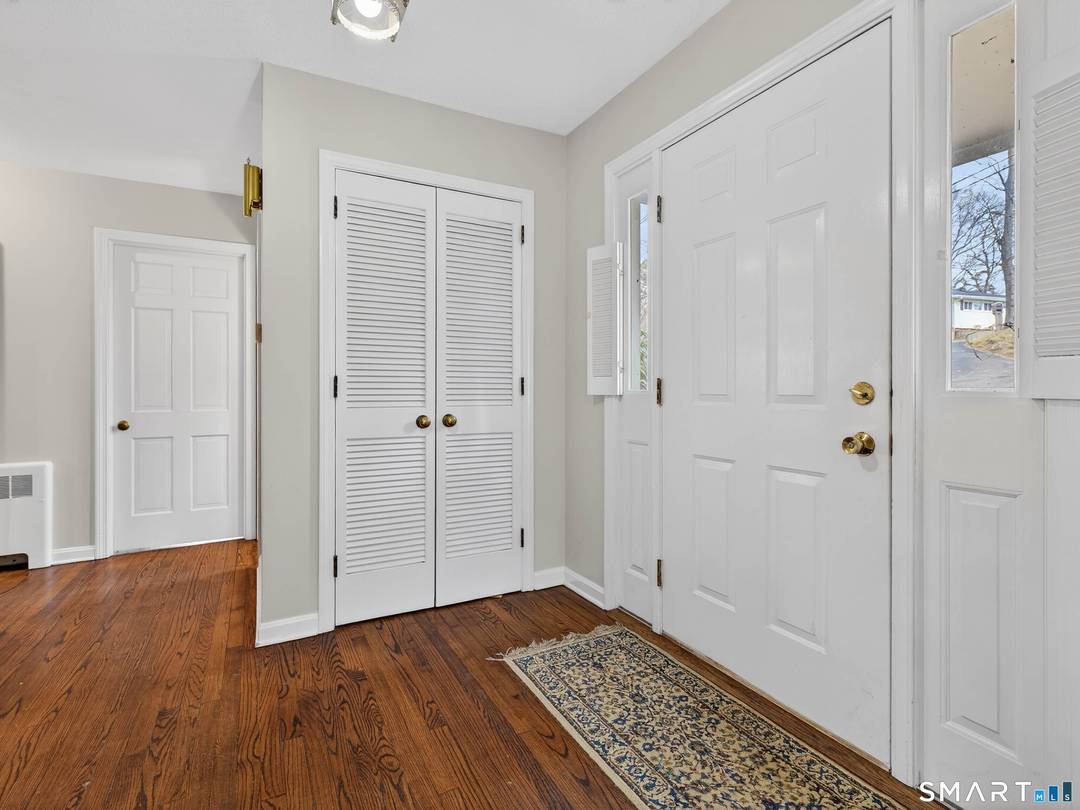 Spacious, classic New England Colonial set on over an acre in the desirable Laurel Hill subdivision.