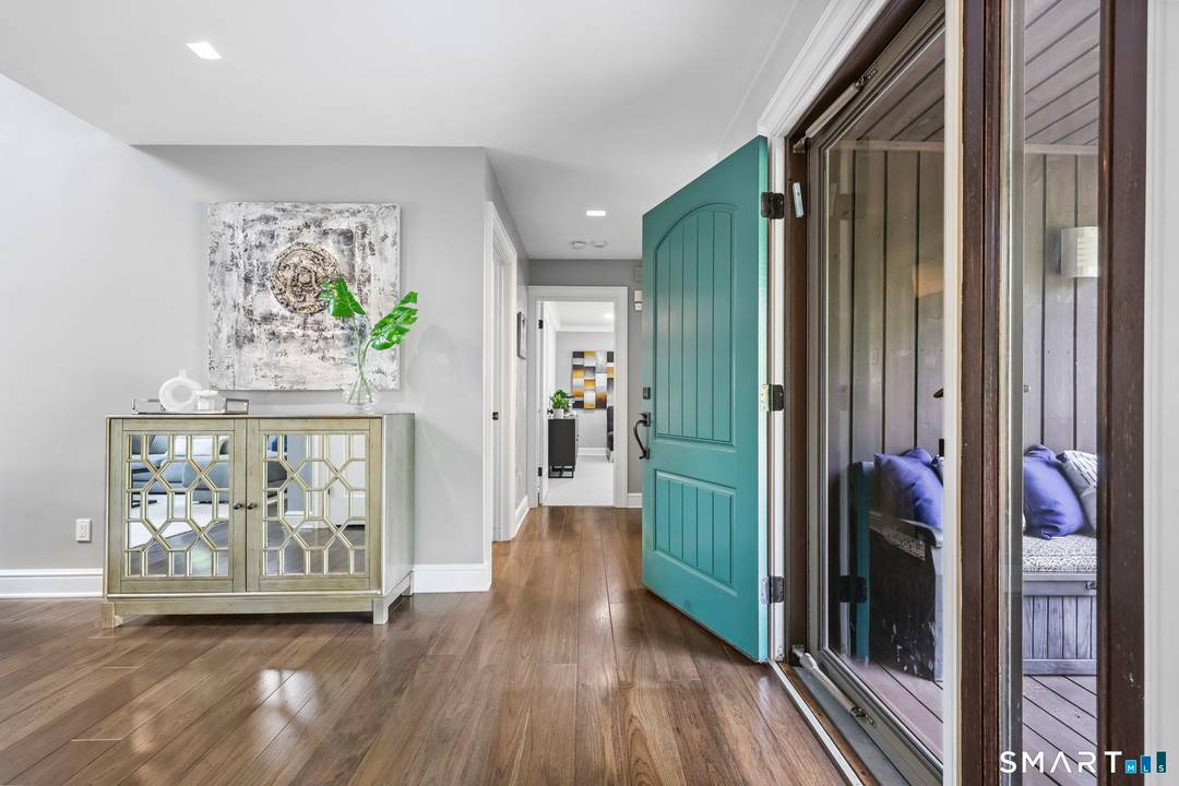 Tucked away on two serene, park like acres in North Stamford, 28 Pony Trail offers a refined blend of modern design and effortless living just minutes from the Greenwich border ...
