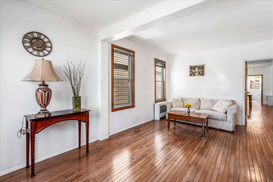 Welcome to this light filled, detached two family home offering the perfect blend of comfort, flexibility, and prime location.