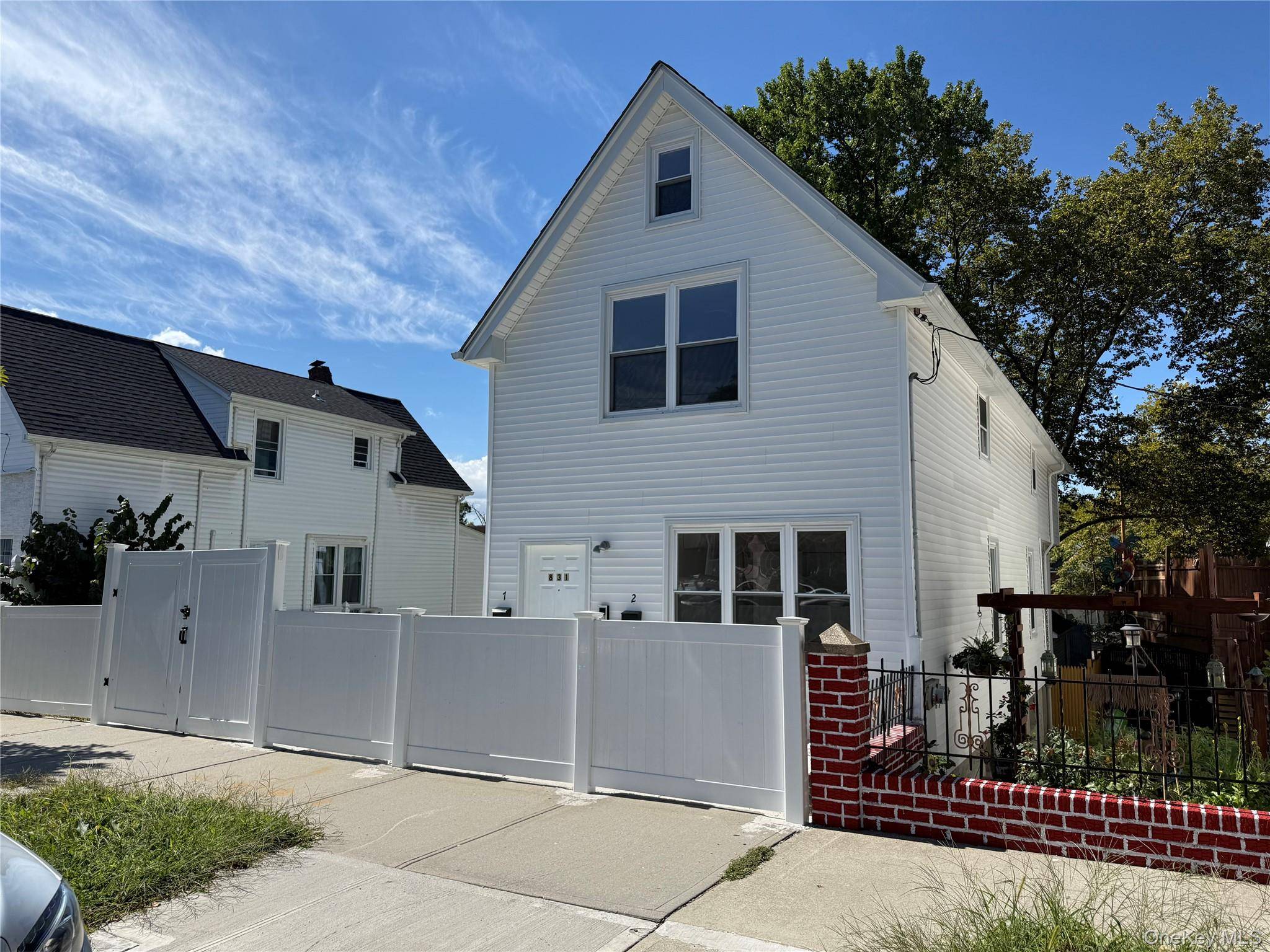 Newly Renovated Two Family Home with Walkout Basement.