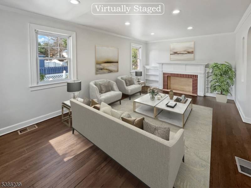 Welcome to this charming property featuring a cozy fireplace, complemented by a soothing natural color palette throughout the home.