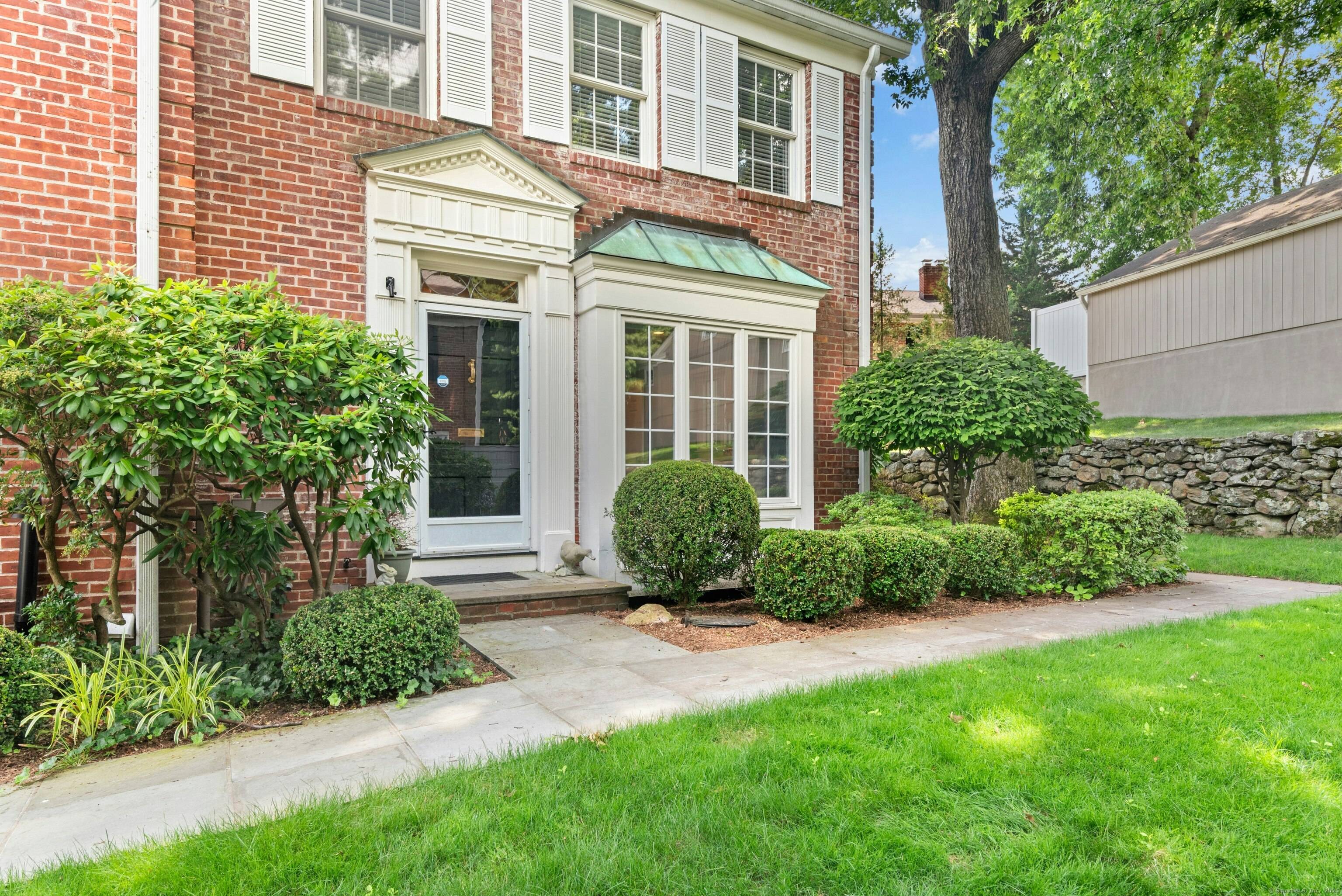 Discover this charming corner unit at Prides Crossing, a collection of 51 elegant brick townhouses just steps from the vibrant village center, offering easy access to restaurants, shops, and the ...