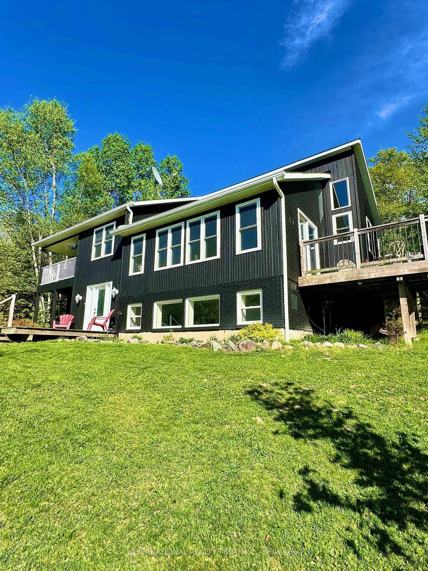 Nestled on 5. 55 acres of beautifully forested land, this fully renovated home offers the perfect blend of rural serenity and modern living.