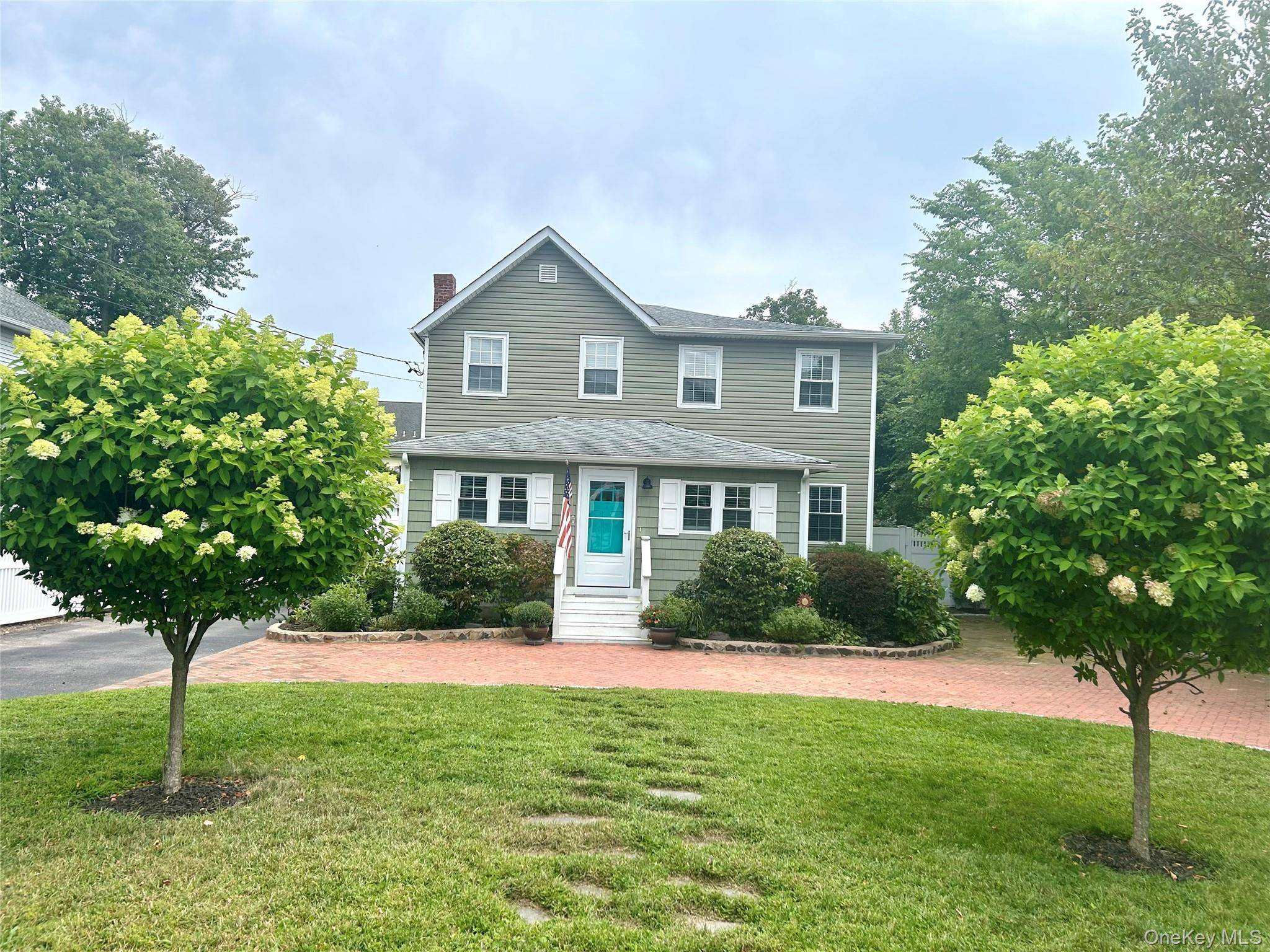 Welcome home to this recently renovated charming colonial, perfectly situated on a quiet street just moments from vibrant downtown Patchogue Village.
