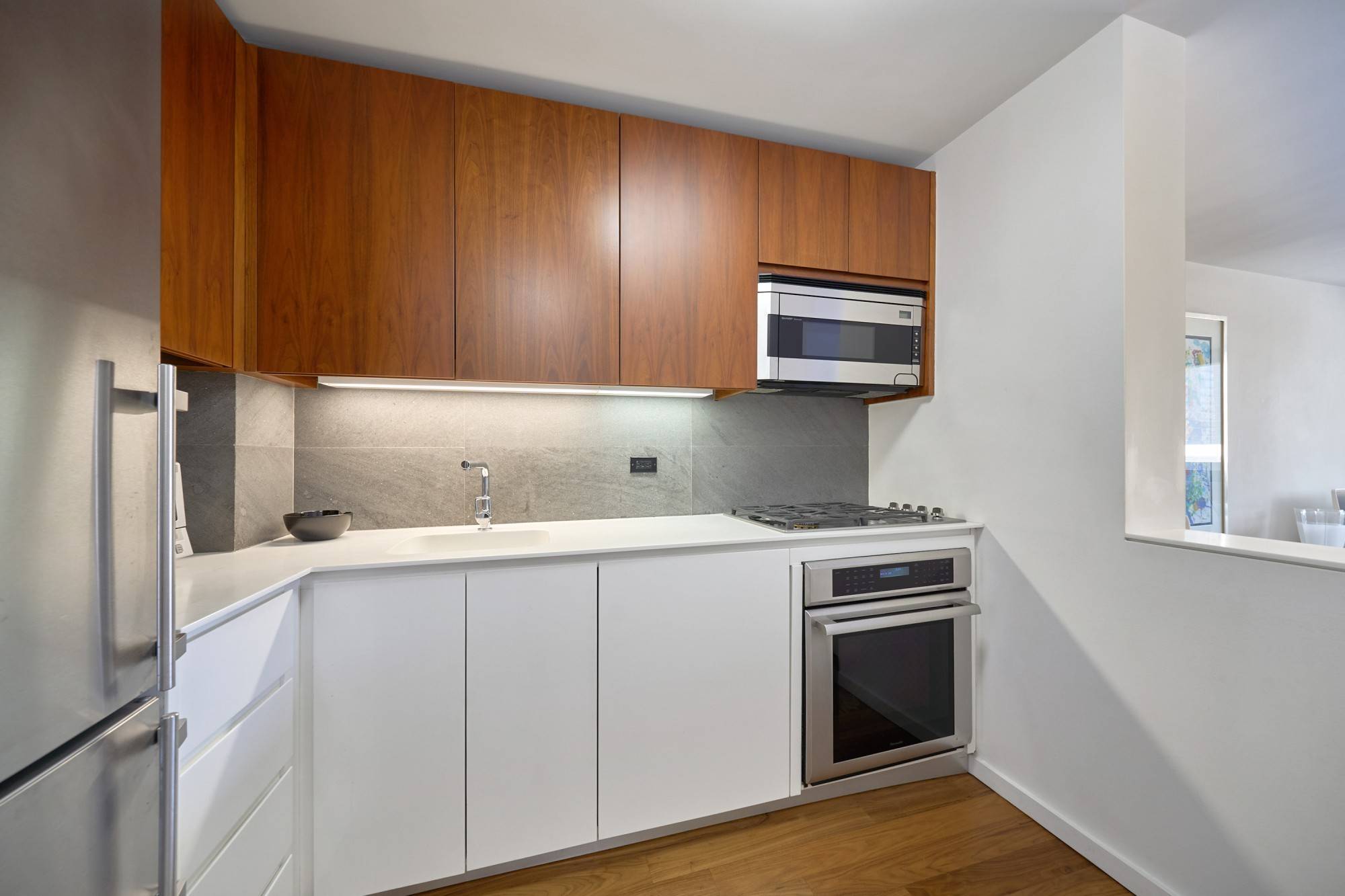 Apartment 9N is a spacious, generously proportioned North facing one bedroom with a King sized bedroom, exceptional closet space, beautiful natural walnut floors, a custom kitchen with walnut and lacquered ...