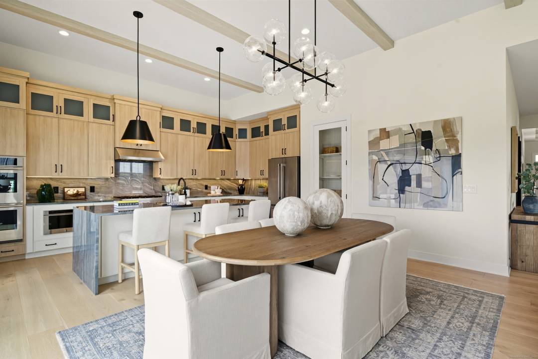 The elegantly appointed Winwood opens with a stylish foyer boasting a tray ceiling and a bright flex room.
