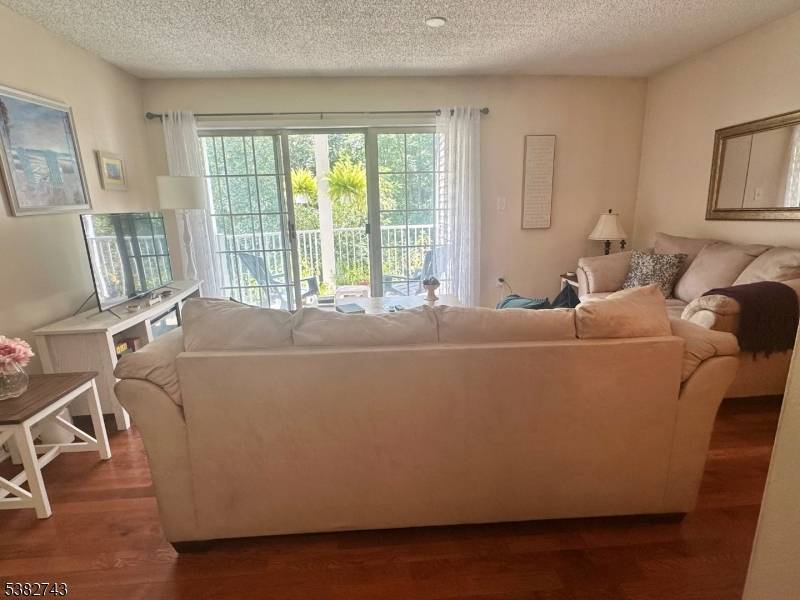 Beautifully maintained 2BR 2BA condo featuring hardwood floors, newer appliances, granite kitchen, and updated light fixtures.