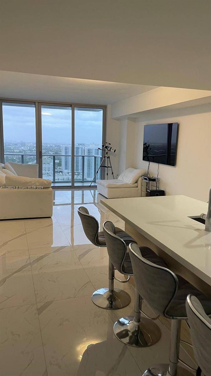 ASSUMABLE LOW INTEREST RATE LOAN Step into luxury living with this stunning 1 bedroom, 2 bath condo nestled in the vibrant North Miami Beach area.