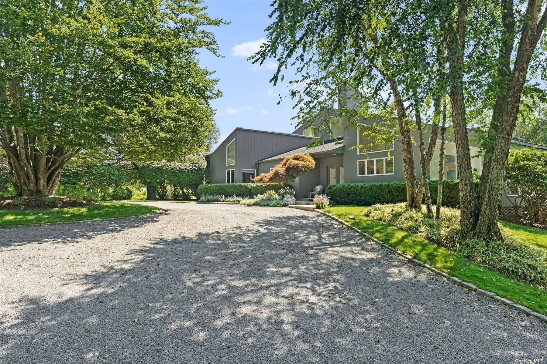 This modern Quogue oasis sits on over 2.