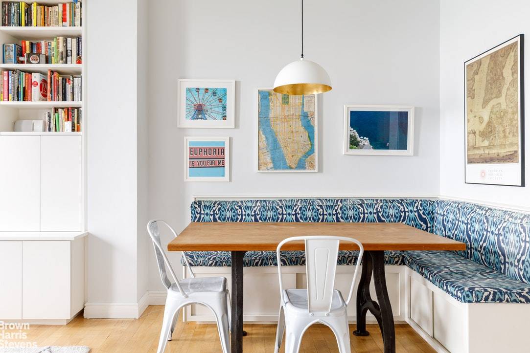 Soaring ceilings, a large built in bookcase and thoughtful banquette flanking the dining area invite you into this one of a kind home.
