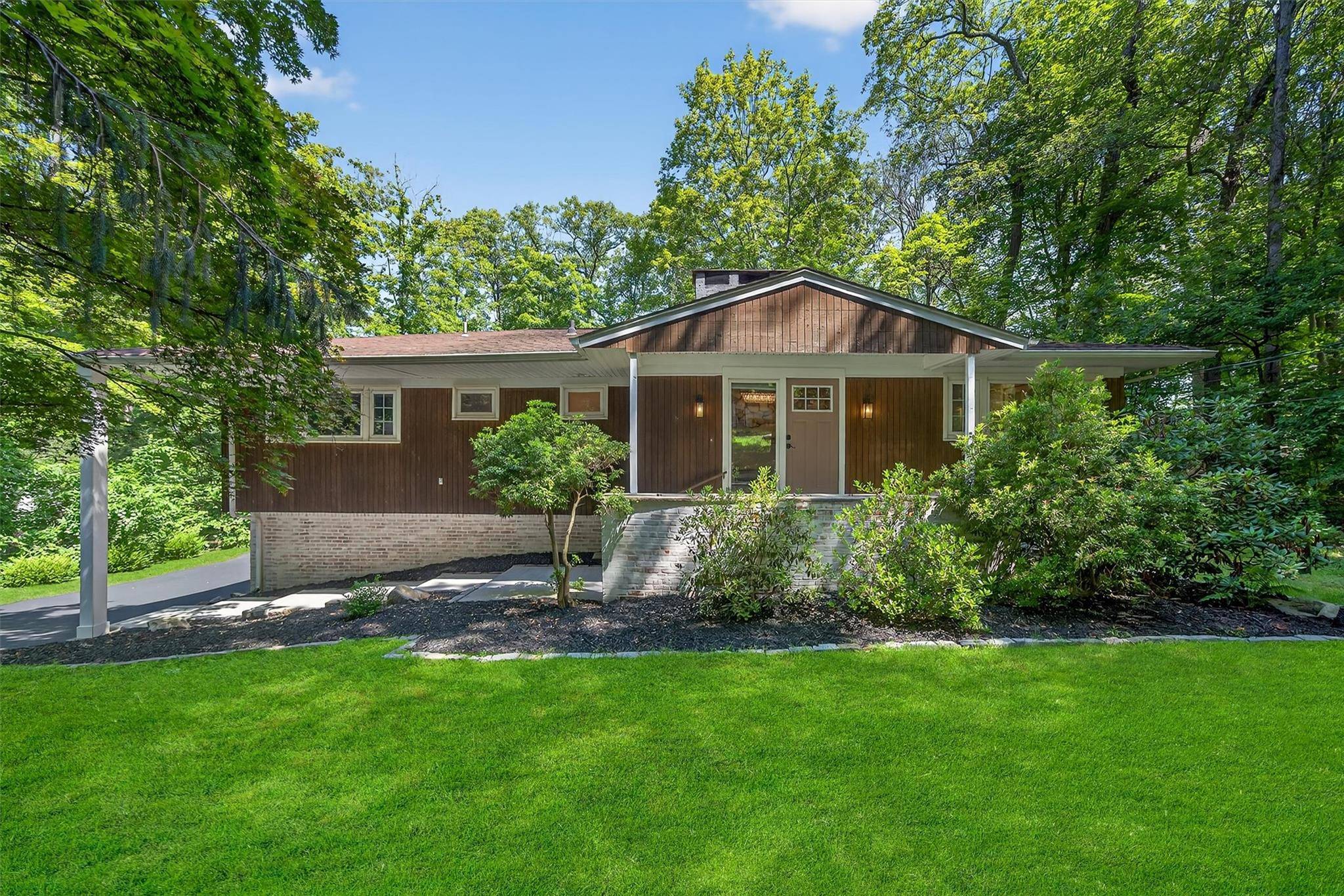 Welcome to your private haven in the heart of the Laurel Ridge community, nestled amid the scenic landscapes of Tuxedo Park, NY.