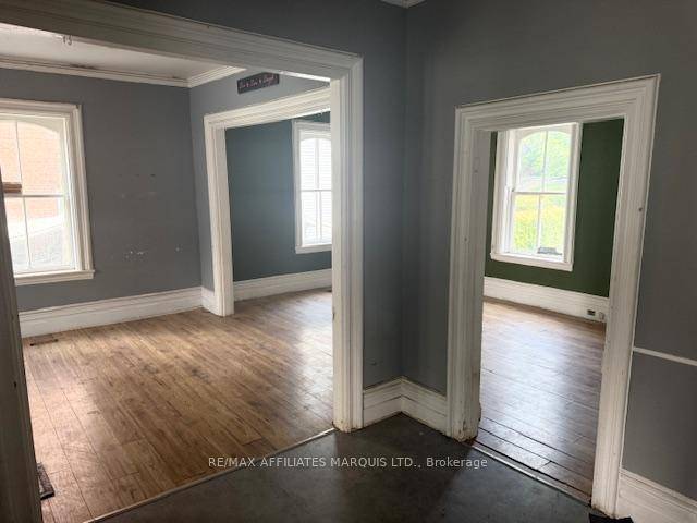 EAST SIDE UNIT VACANT ! Located in the heart of Morrisburg this stately two storey semi detached brick home offers charm, character, and endless potential.