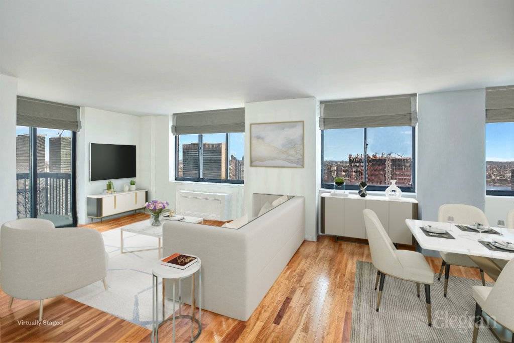 Sprawling Sun Flooded High Floor Condo with 2 Balconies and Spectacular Skyline and River Views.