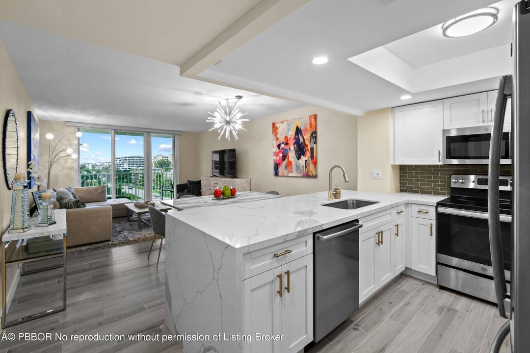 Enjoy oceanfront Palm Beach living in this completely renovated 2 2 !