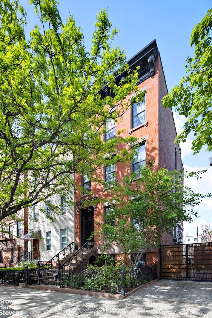 Tucked behind a beautifully restored facade on a quiet, tree lined block, 185 12th Street is a masterclass in thoughtful renovation and timeless design.