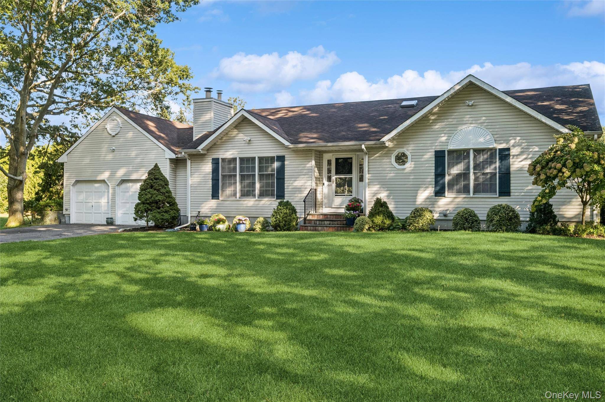 Welcome to 160 High Meadow Lane, a charming gem nestled in the heart of Jamesport, New York.