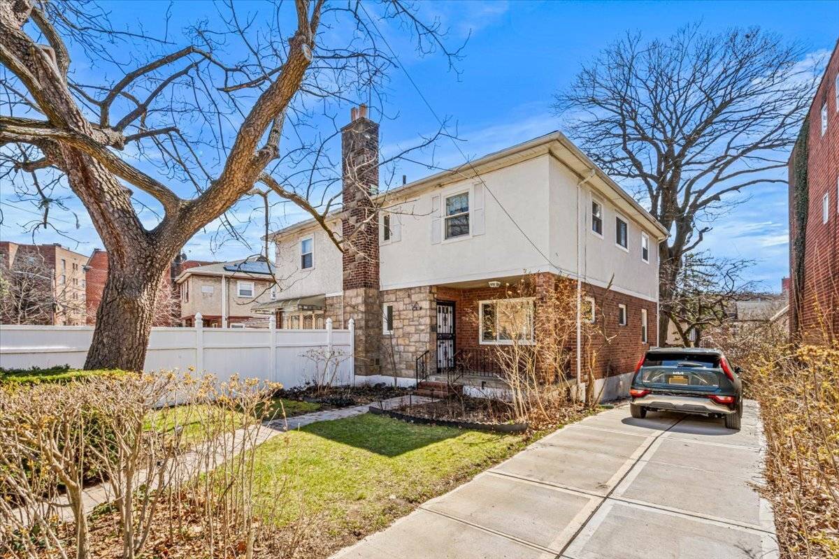 Welcome to this pristine semi attached brick townhouse nestled in the heart of Briarwood, Queens.