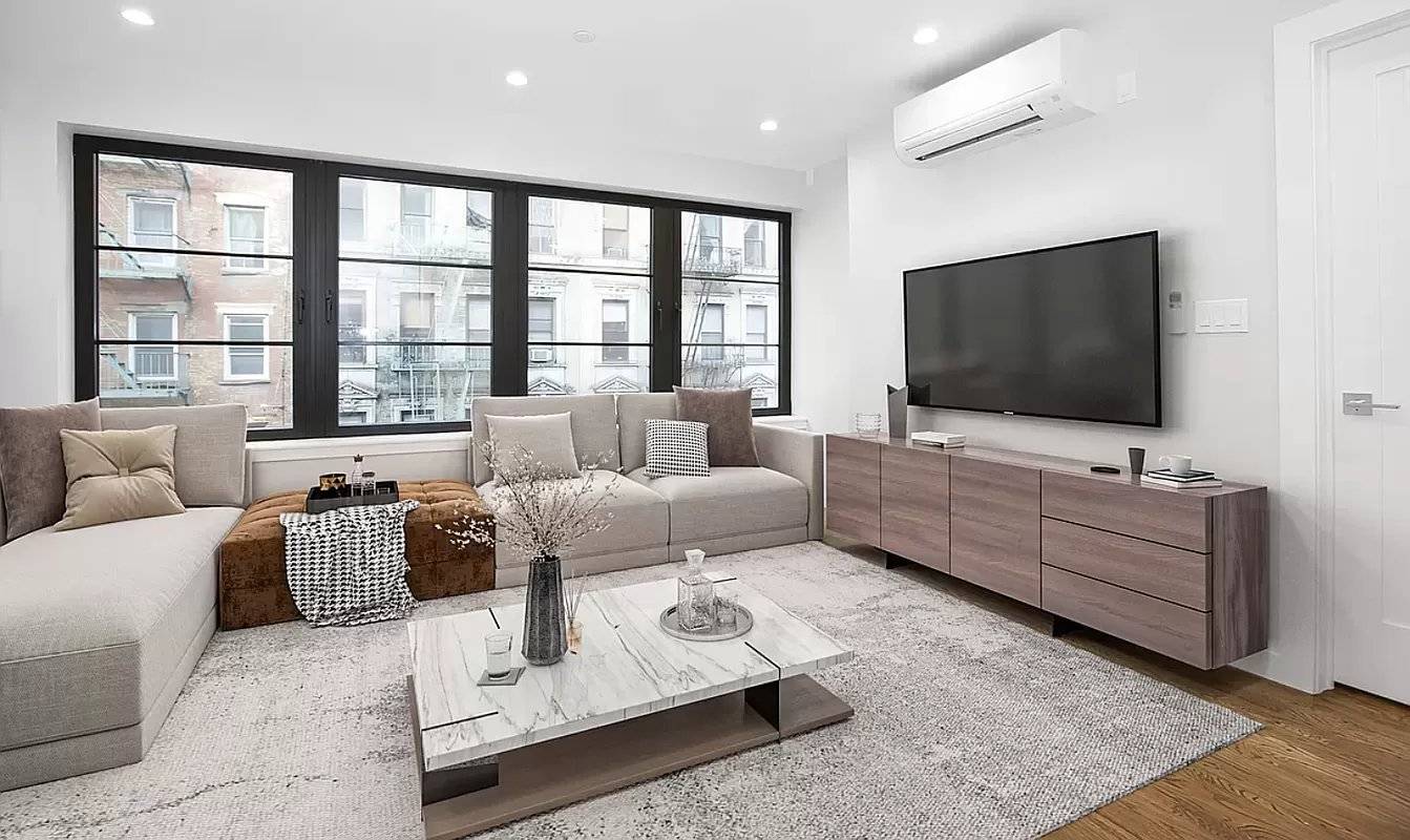 Live in this fully renovated floor through 3bedroom, 2 bathroom townhouse with balcony at 152 Ludlow Street !
