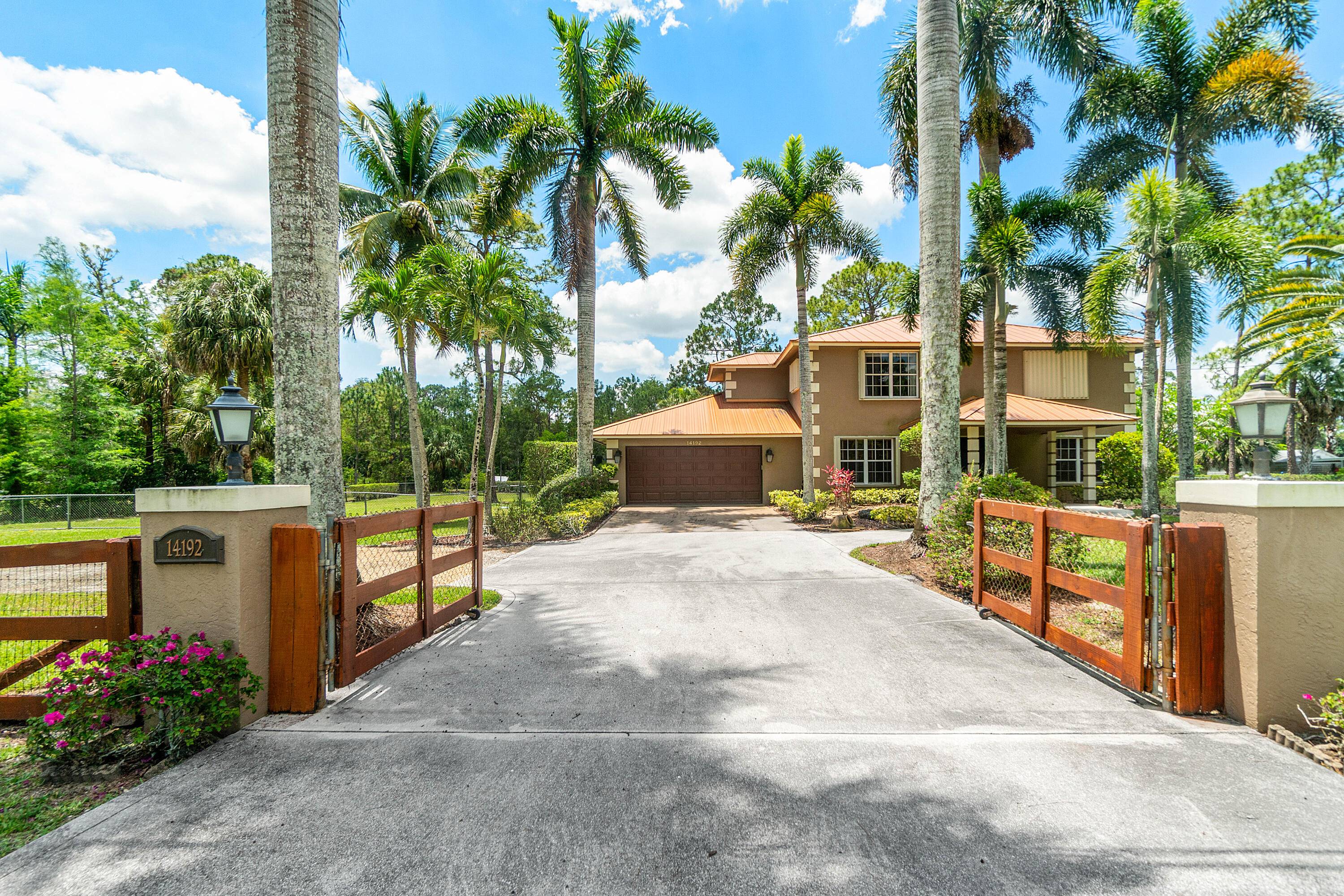 Escape to peaceful, spacious living at 14192 82nd Street N in Loxahatchee.