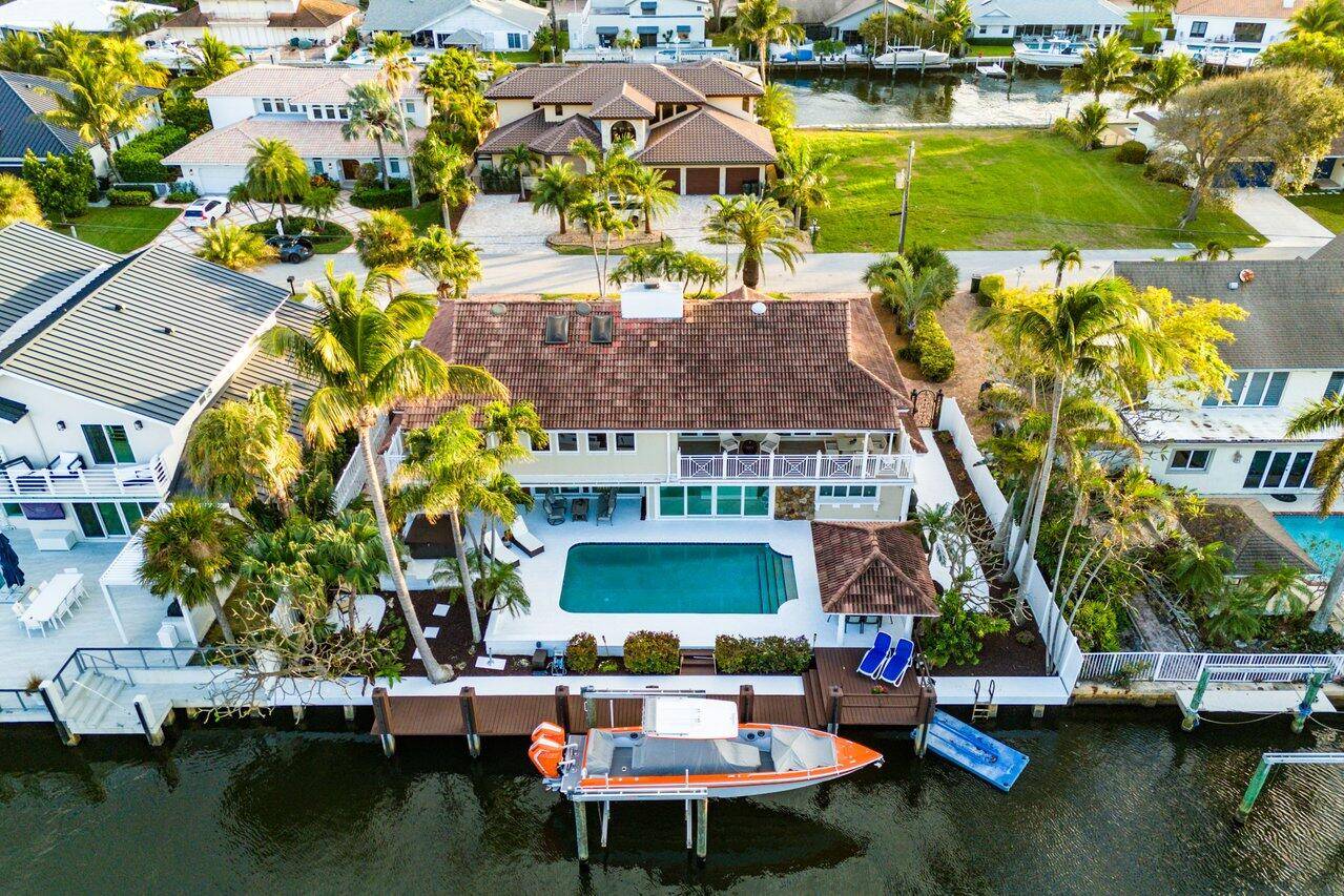 Welcome to 937 Fern Drive, a breathtaking waterfront residence nestled in Delray Beach's prestigious Tropic Isle neighborhood.
