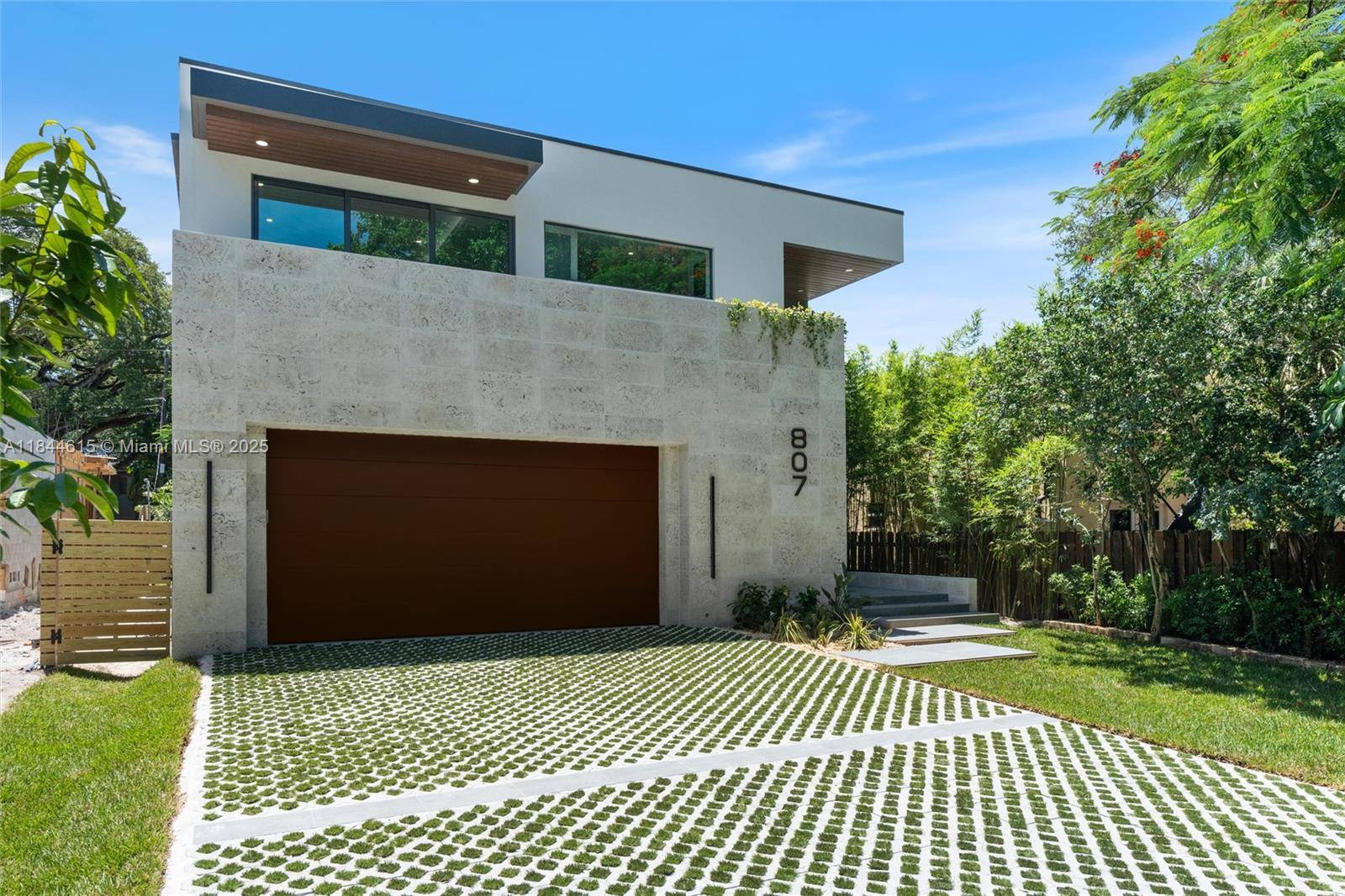 Brand New 2025 Construction Home Experience tropical modern luxury in this stunning all concrete residence built for strength and durability.