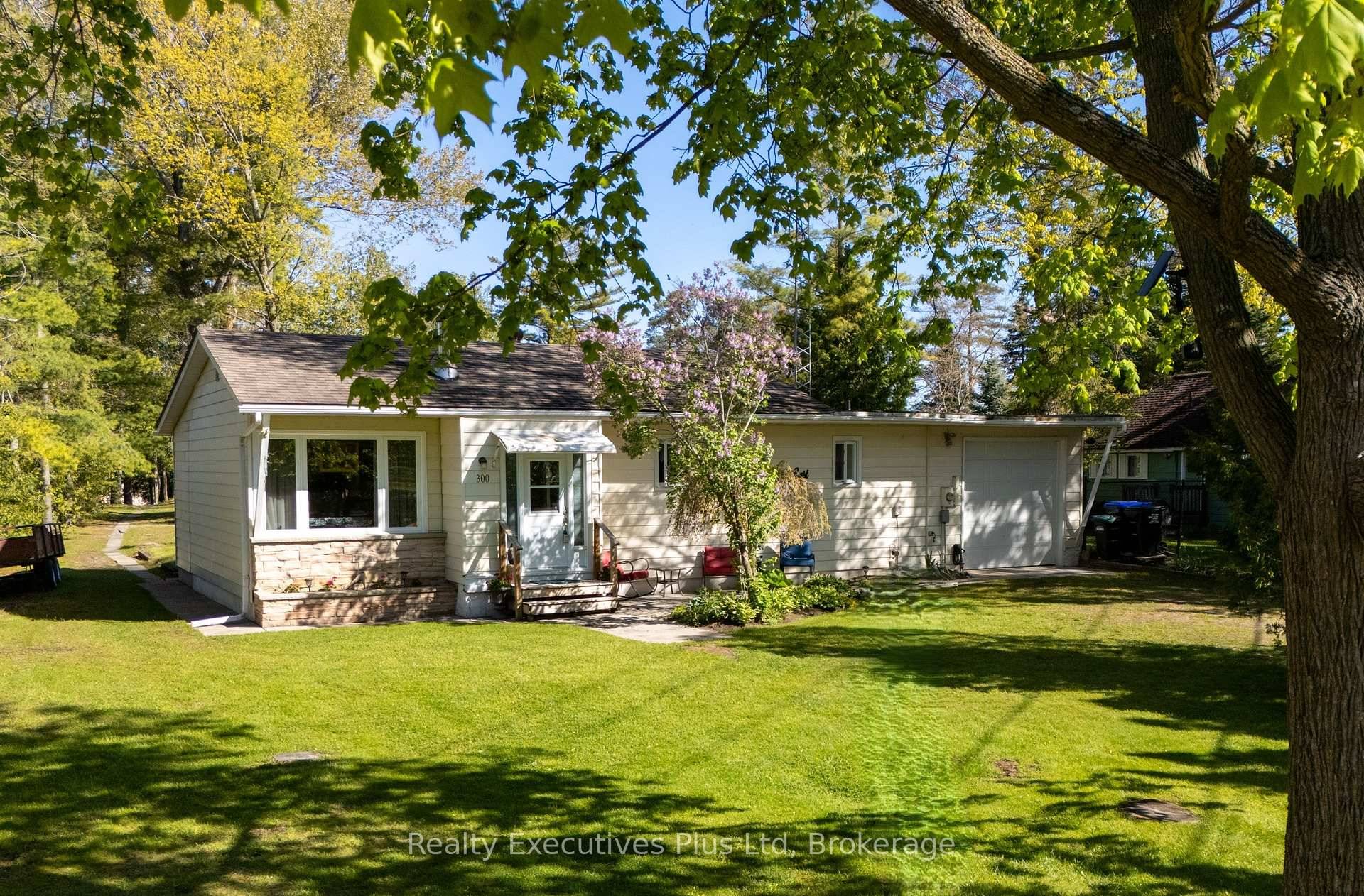 Nestled among mature trees along the Nottawasaga River, this 3 bedroom, 4 season home in Wasaga Beach offers an ideal waterfront lifestyle just three properties from Sturgeon Point Marina.