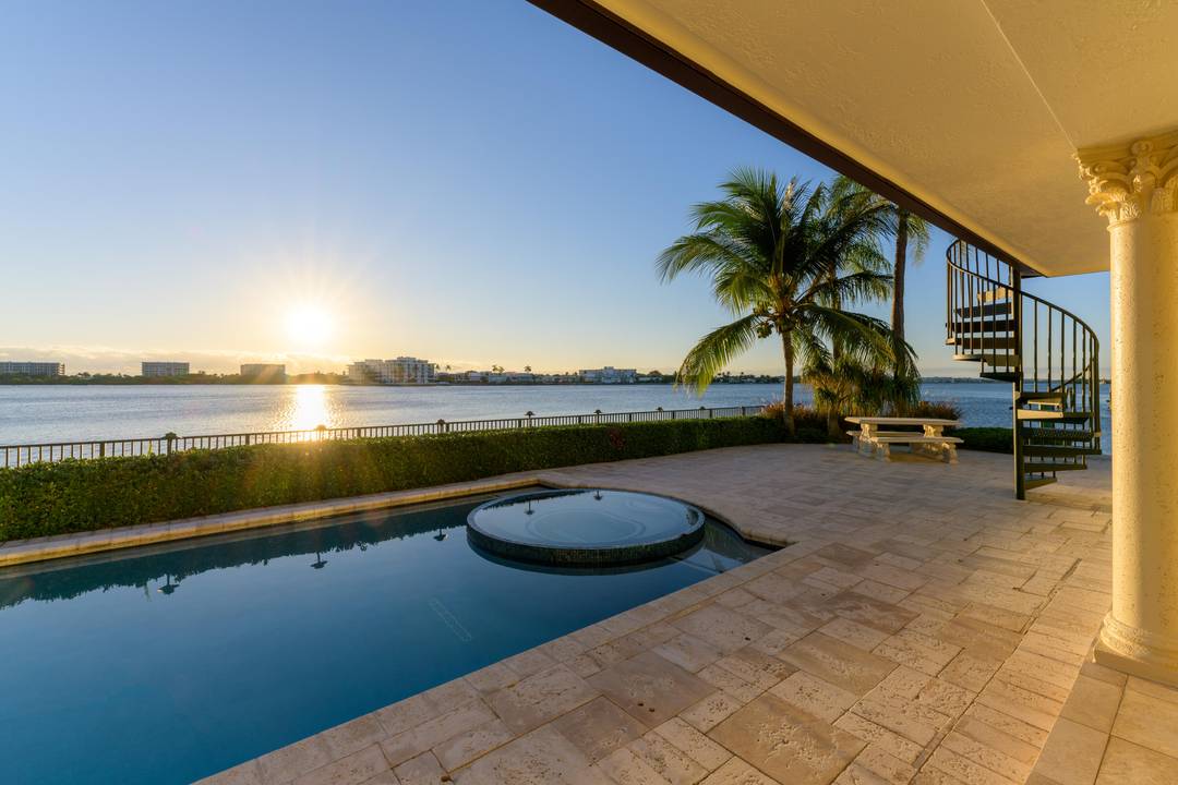 Awake to breathtaking sunrises while enjoying sun bathed living spaces offered by this waterfront estate with coveted unobstructed East and Southeast vistas across wide water affording unparalleled security and privacy.