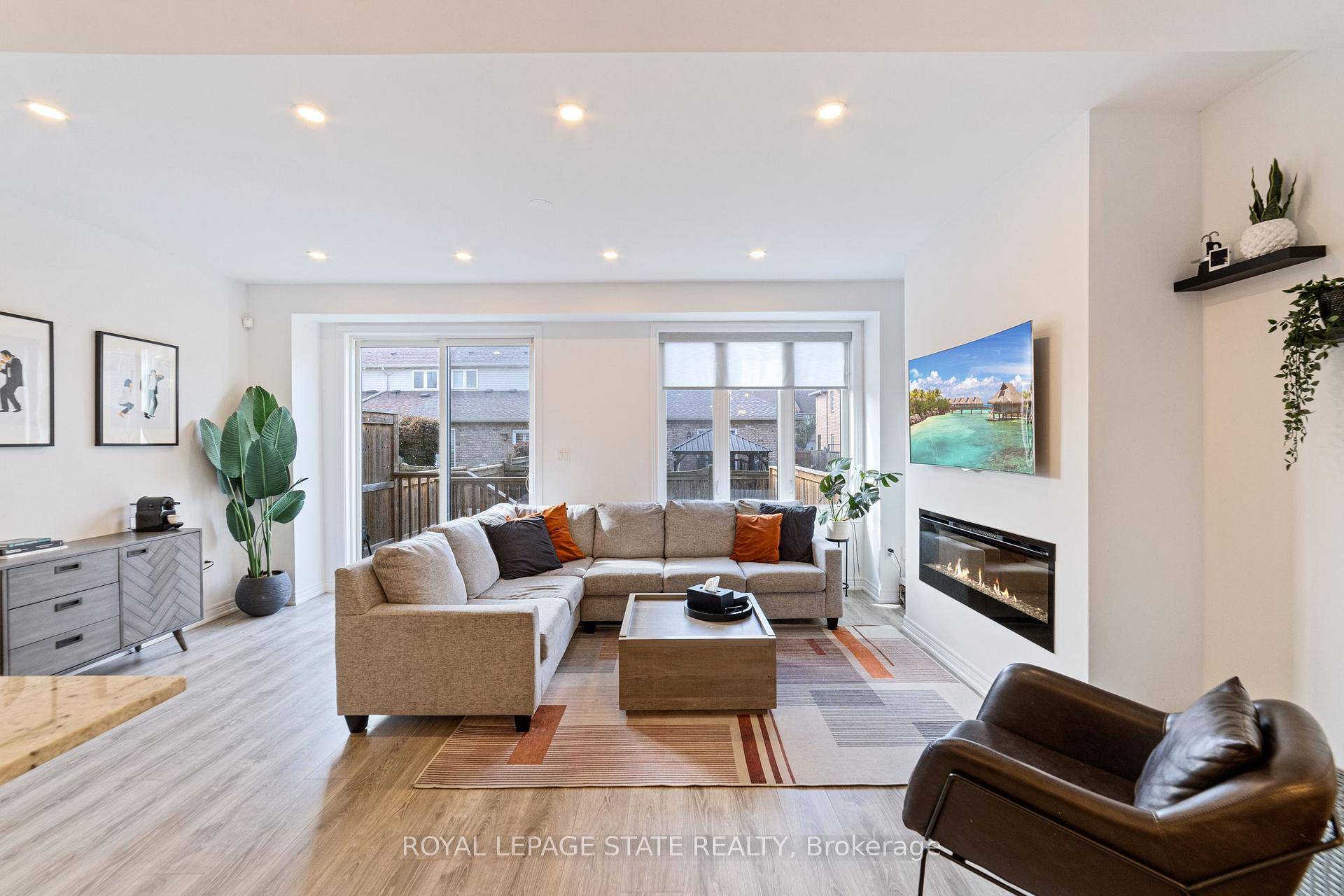 This beautifully crafted two storey townhome by Branthaven Homes boasts a striking brick and stone exterior that exudes curb appeal.