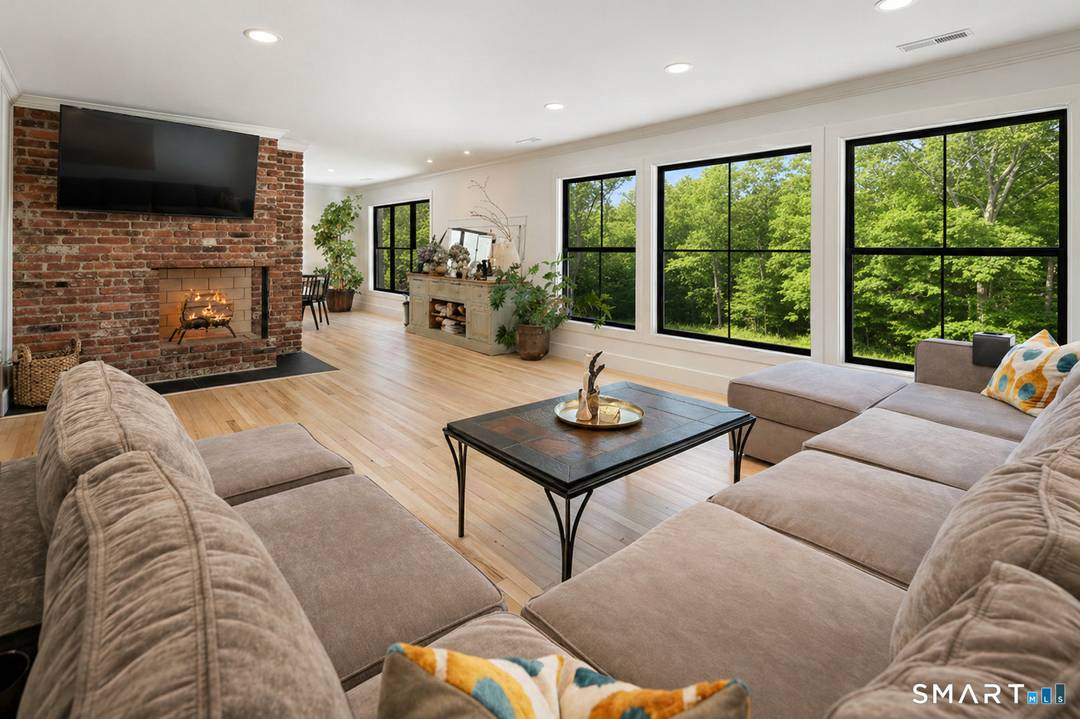 Located in the highly sought after Charcoal Hill neighborhood, this home sits on 2 private acres bordering a 7 acre Aspetuck Land Trust preserve.