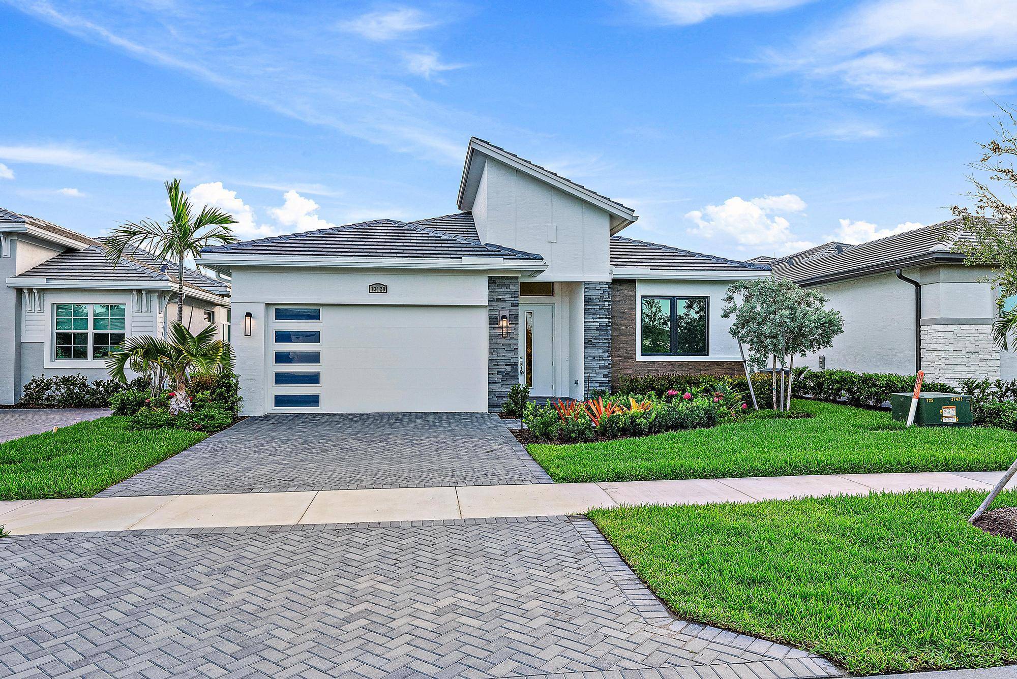 Welcome to 13129 SW Shinnecock Drive, a stunning 2024 built extended ''Jordan'' model by Kolter Homes, nestled in the highly sought after Astor Creek Golf Country Club.