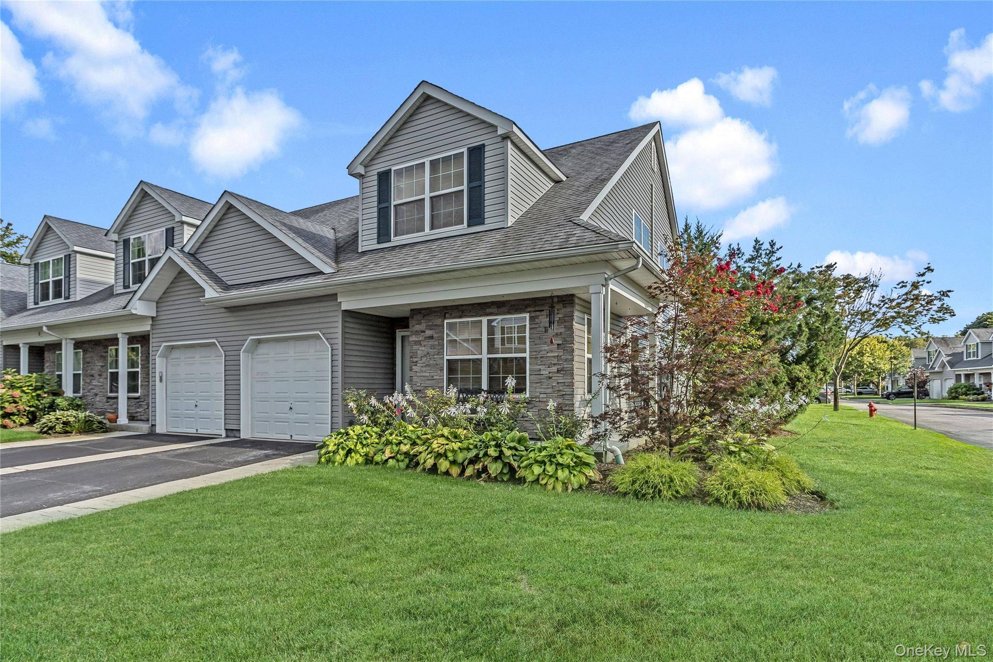 Discover this Pristine Diamond Corner Unit Townhouse in Islip Landing 55t Community.