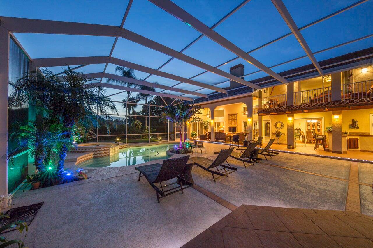 Tucked away on a serene half acre canal front homesite inside Meadowood's guard gated Golf and Country Club, this custom 3 bed, 3 bath home is moments from Vero Beach, ...