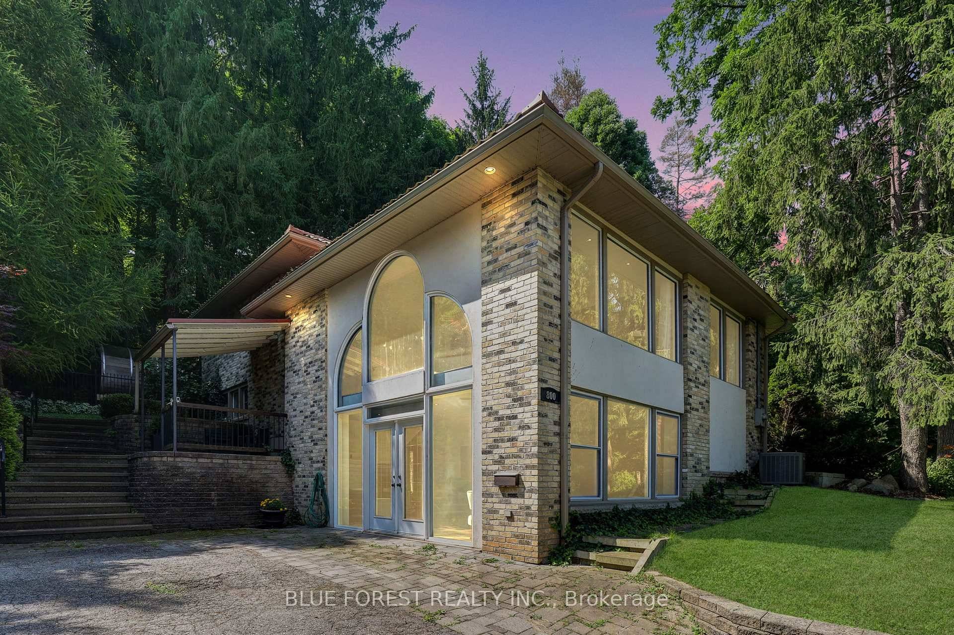 Situated directly across from the iconic Springbank Park, this hillside home offers an unmatched connection to nature in the heart of the city.