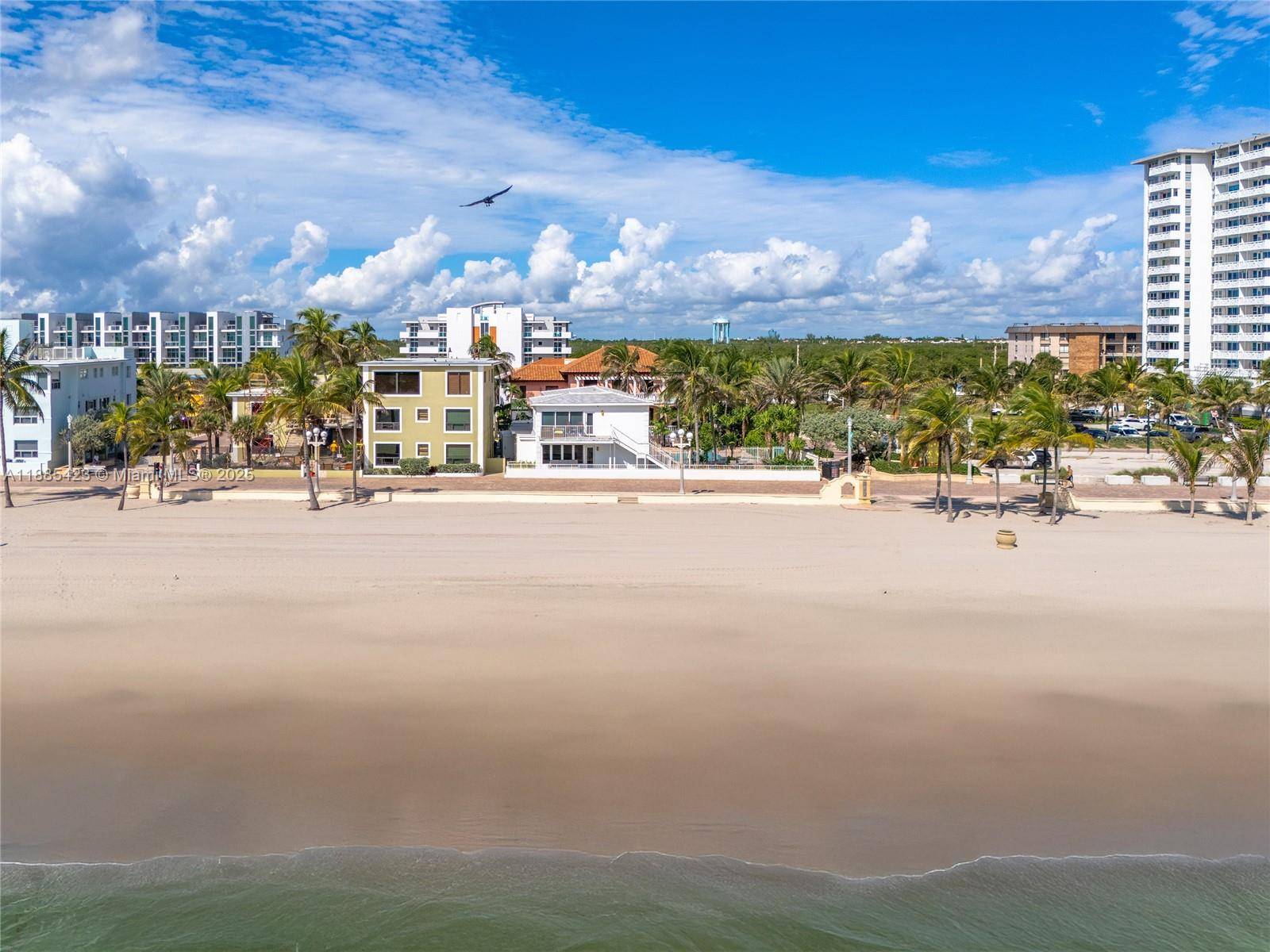 Experience South Florida living with this rare double lot property directly on the sand and iconic Hollywood Beach Boardwalk.