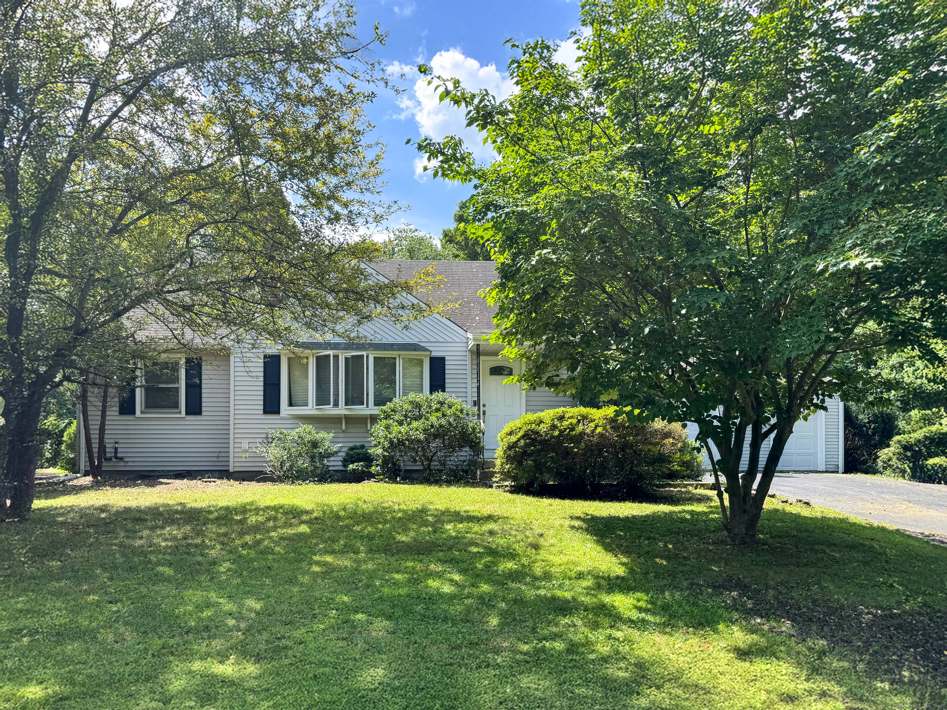 Opportunity knocks at 5 Hickory Hill Road bring your style and imagination to this spacious home tucked away on a quiet street in one of Simsbury's most convenient neighborhoods.