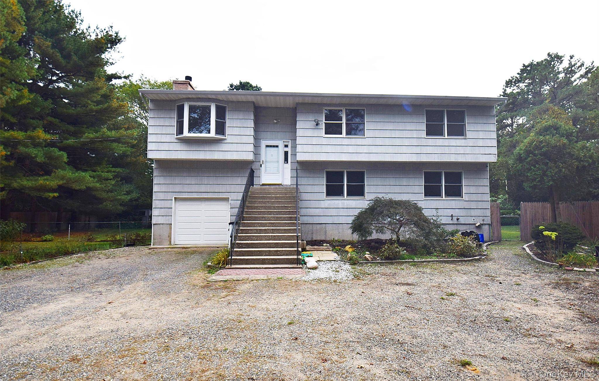 Must see huge 5 bedroom Colonial set on acre fully fenced property.