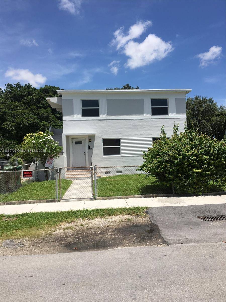 Remarkable 2 story centrally located triplex with brand new roof.